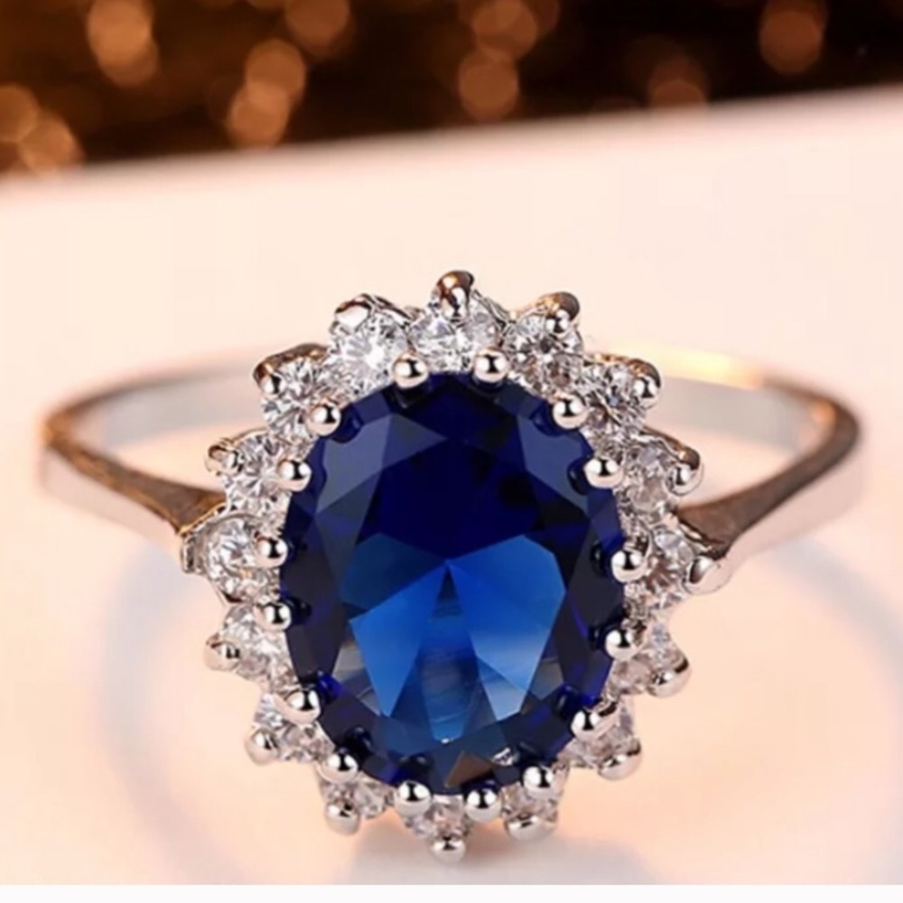 18K WHITE GOLD OVAL BLUE SAPPHIRE PRINCESS RING